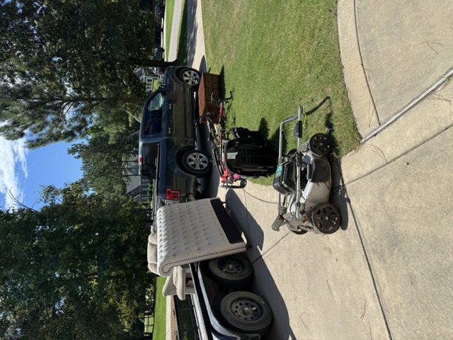 Junk removal trailer loaded and hauling sofa, lawnmower, and misc items — Moore County NC