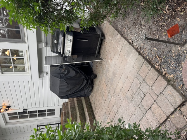 After wide view: cleared back patio and side yard at Pinehurst Village renovation